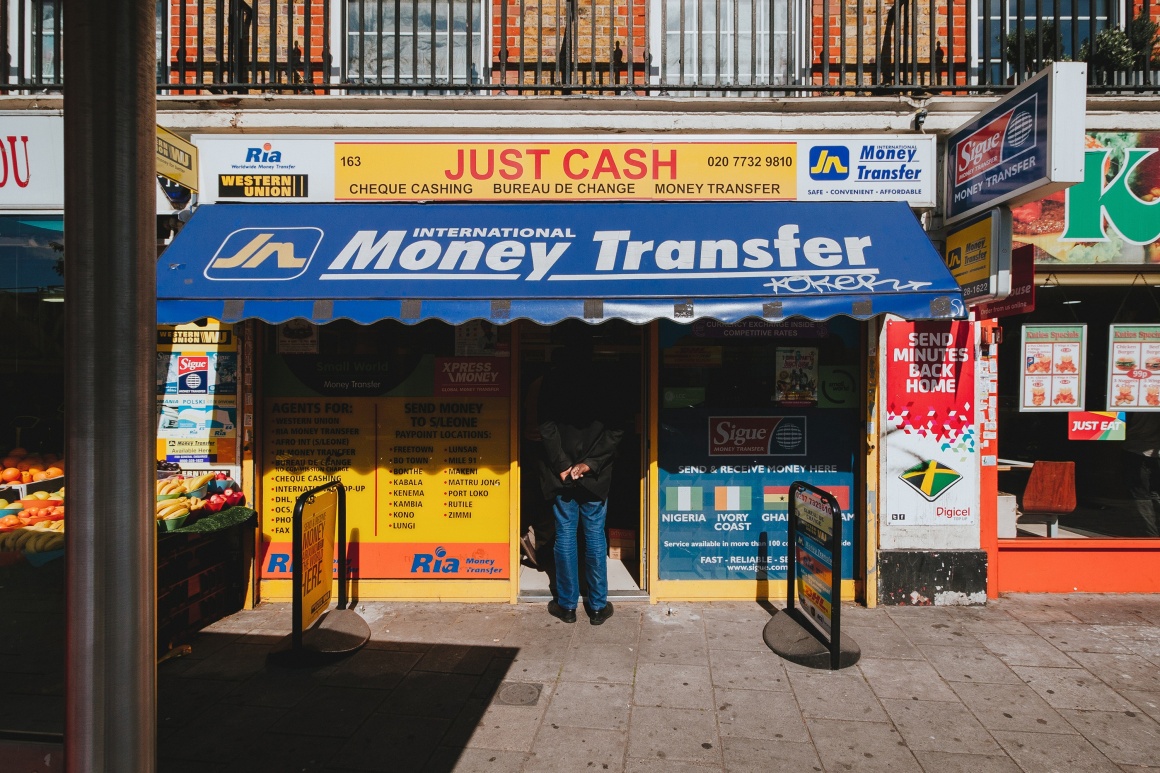 Money Transfer; Copyright: Alistair MacRobert/Unsplash...